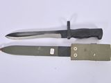 two knives that are laying next to each other on a table