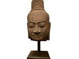 an image of a statue of a head on a stand