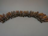 a lot of small wooden pegs on a table