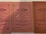three books are sitting on a table with a white table cloth