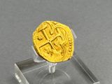 an image of a gold coin sitting on top of a clear display case