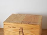 a wooden box that has a wine label on it