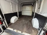 a white van with two beds in the back of it