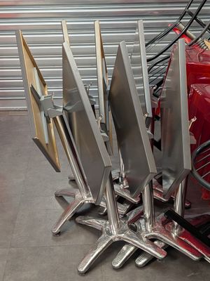 a lot of knives that are sitting on the back of a red car