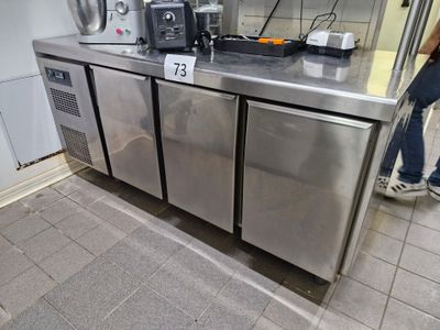 a stainless steel counter with a toaster and a toaster on it
