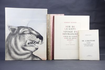 three books are sitting on a table next to each other