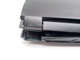 a laptop that is sitting on top of a pile of papers