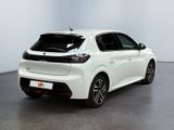 the rear of a white car parked in a room