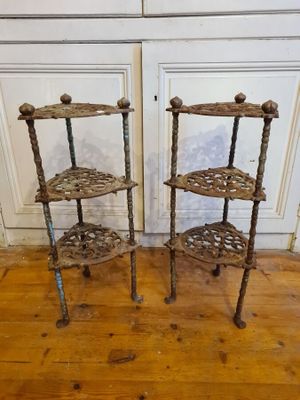 two shelves that are sitting on a wooden floor