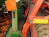 an image of a machine that is working in a barn
