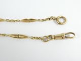 a pair of gold plated chains with clasps on them