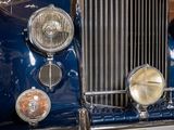 a close up of the front end of a blue car