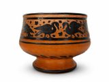 un vase marron et noir orné d'un motif représentant un oiseau