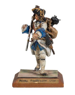 figurine of a soldier with a rifle and a dog