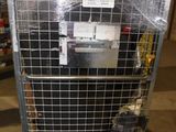 a metal cage with a bunch of items in it