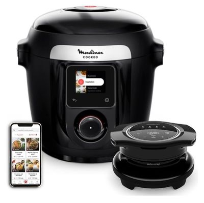 un gros plan d'une friteuse à air chaud noire et argentée à côté d'un iPhone