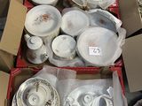 many different types of dishes and bowls in a box
