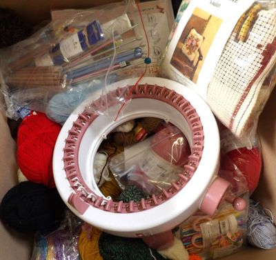 a box full of yarn and other items that are in it
