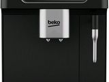 une machine à café noire posée sur un plan de travail blanc