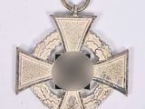 an image of a silver cross on a white background