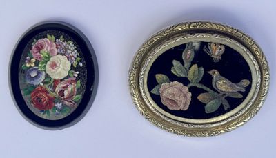 two framed pictures of birds and flowers on the wall