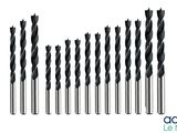 a dozen of drill bits are lined up on a white background