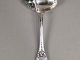 silver spoon with a spoon shaped like a spoon with a spoon handle