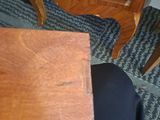 a chair and a table in a small room