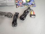 a video game system and a game controller on a table