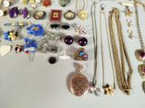 many different types of jewelry on the table