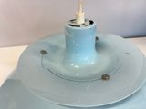 a blue light that is on top of a white table