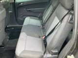 the back seats of a car are empty and the passenger seat is empty
