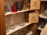 a pantry with a lot of glass jars and jars on the shelves