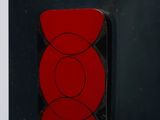 a close up of a red object on a black object