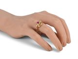 a close up of a person ' s hand with a ring on it