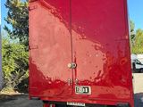 a red truck that is parked in the parking lot