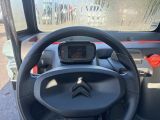 the steering wheel of a small vehicle with a gps device on it