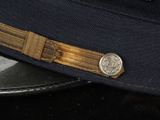 a close up of a hat with a metal buckle on it