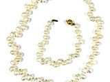 necklace and earring set with white pearls on a white background