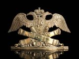 a close up of a metal object with an eagle on top of it