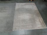 two rugs that are on the floor in a room