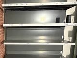 many empty shelves in the middle of a room
