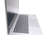 a laptop computer that is open on a white surface