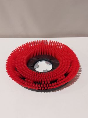 une image représentant un pinceau rouge posé sur une table blanche