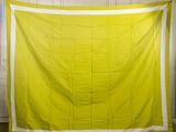an image of a yellow and white quilt hanging on a wall