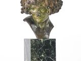 sculpture of a bust of a boy with curly hair on a marble base