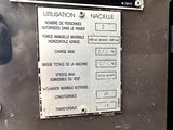 a sign on the side of a machine that says