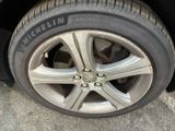 a close up of a tire on a car ' s rim