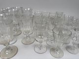 a lot of empty wine glasses sitting on a table