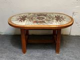 a small table with a tile top on it